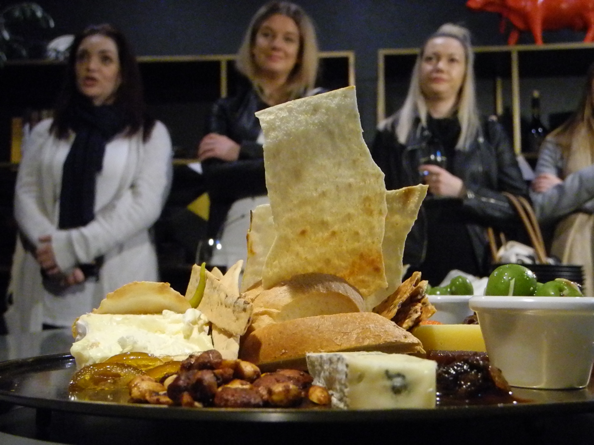 Curated cheese board with wine at a Perth venue on the Fromage Walking Tour